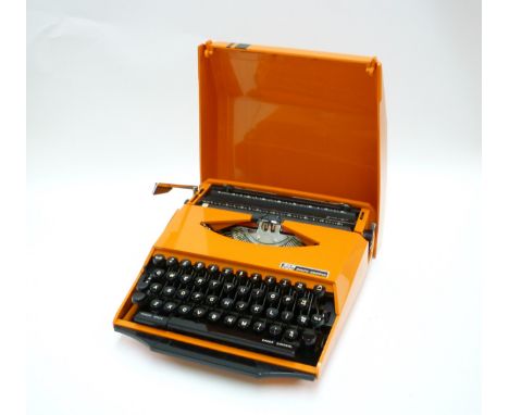 A Smith Corona GT Typewriter in orange, 'Design by Ghia' 
