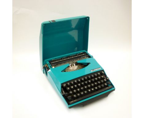 A Smith Corona GT Typewriter in blue, 'Design by Ghia' 