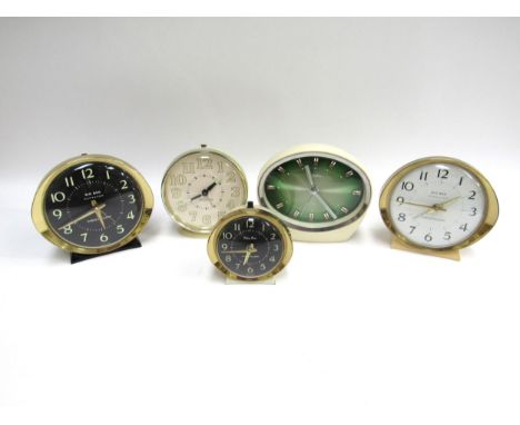Two Westclox Big Ben alarm clocks, a Baby Ben, Westclox glow in the dark model and a Rhythm Japanese clock. Tallest. 12cm. 