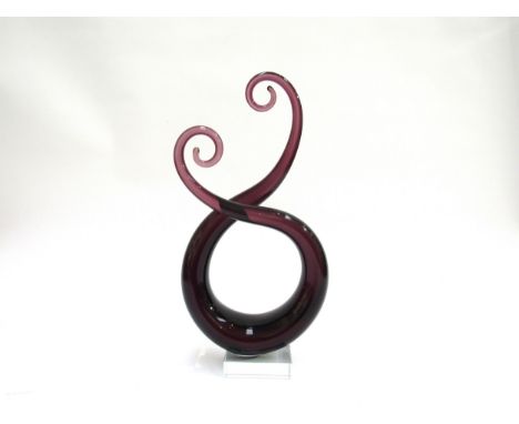 A Murano style amethyst glass swirl sculpture on a clear glass plinth base. 33.5cm high 