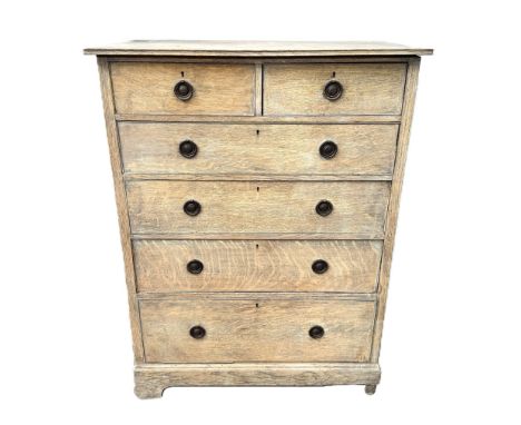 A light oak chest of drawers with two short over four graduated drawers, 123 x 92 x 52 cm.&nbsp;