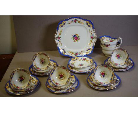 Twenty piece Paragon part tea set floral decorated; including 5 trios, extra saucer & plate, cake plate, sugar bowl and cream