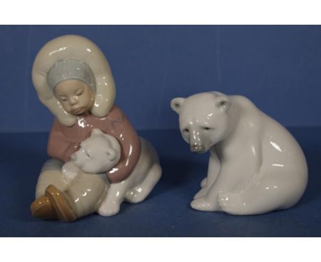 Two Lladro polar bear figurines to include Eskimo child & polar bear #1195, and seated polar bear #1209, height 12.5cm approx