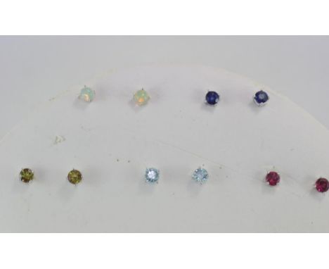 Five various pairs of gemset studs including ruby, opal, topaz and peridot, including holder