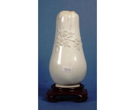 Vintage Chinese white ceramic vase floral decoration in relief. On wood stand. Height 16cm approx (vase only).