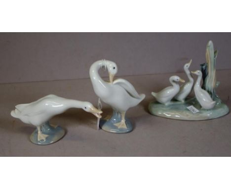 Pair Lladro duck figures height 11cm approx (taller figure); together with Nao three ducks figure.