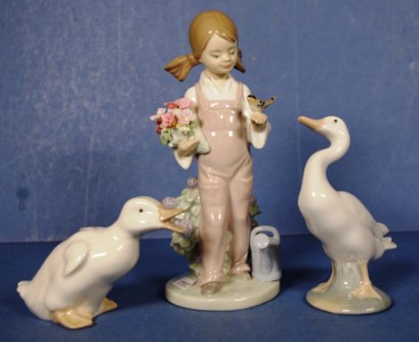 Two Lladro figurines to include spring girl model 5217, and a duck, together with a Neo duck figurine, height 19cm approx (ta