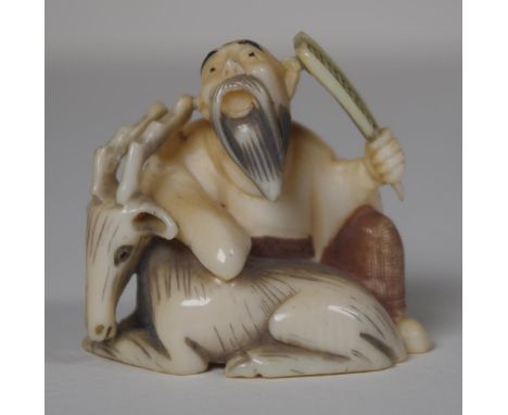 Antique Japanese ivory netsuke - Man & Deer 3.8cm high. This item may not be exported without CITES documentation.