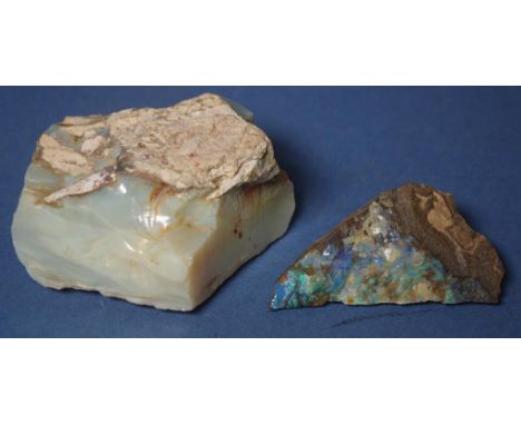 Two rough opal specimens comprising of a Lightning Ridge opal with potch 10cm x 11cm and boulder opal 8.5cm x 4.5cm