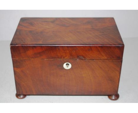 Early Victorian flame mahogany tea Caddy on flat bun feet, twin lidded interior with turned ivory knobs, circa 1840, 19cm x 1