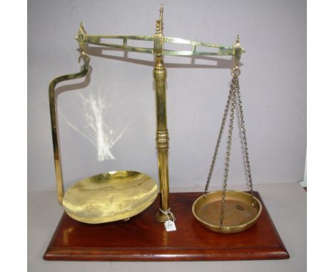Set of early Victorian brass beam balance scales on a mahogany base, pre-set to 2lbs, circa 1840s, 50cm high approx.