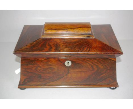 Large Regency Brazilian rosewood sarcophagus caddy with gilt brass lion ring handles, the interior with lidded compartments &