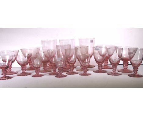 Nineteen assorted vintage pink art glasses with twisted stems