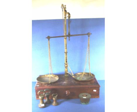 Vintage pair brass shop scales on wood base with 1 drawer below; together with 3 bell weights, 10oz, 20oz and 30oz; and set c