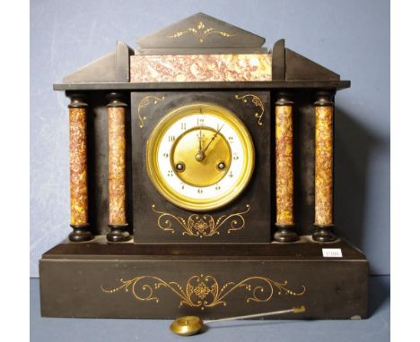 French C:19th slate and marble cased mantle clock with eight day striking movement, together with pendulum, height 34cm appro