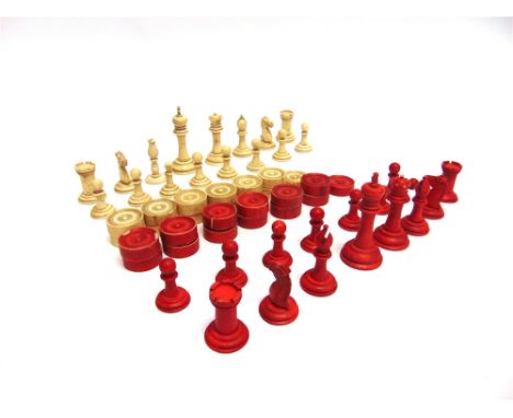 A STAUNTON PATTERN BONE CHESS SET  natural white and stained red, the kings 75mm high (one replacement, non-matching white bi
