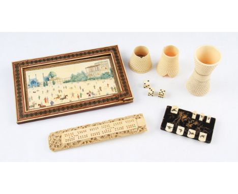 A lot to include two carved ivory dice cups of waisted form with dot design, one A/F, three ivory dice, early 20th Century ga