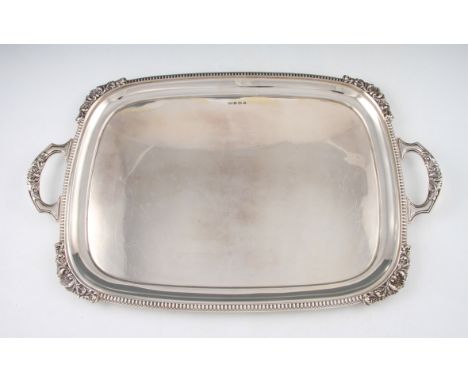 A Walker and Hall twin handled silver tray with shell design corners and beaded rim and having shell design handles, hallmark