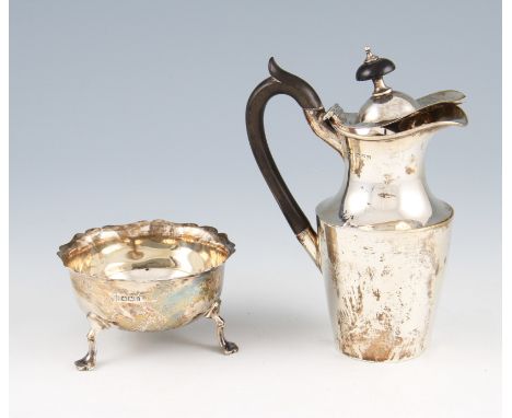 A Victorian silver lidded jug, with ebony handle and finial, having shoulder rising to flared neck, lid having space for spoo