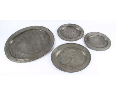 A group of four 19th Century Victorian London pewter oval plates, each heavily decorated with an English figural scene with e