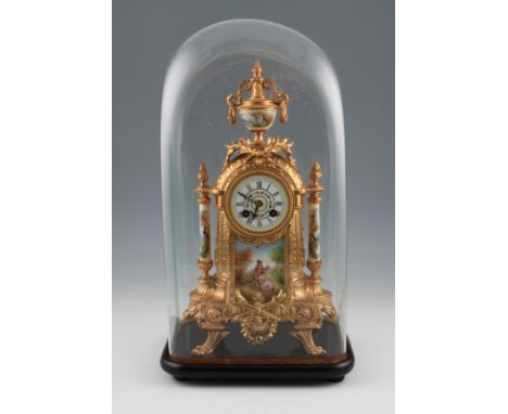 A 19th Century French ormolu mantel clock of ornate design having central figural design porcelain painted plaque with porcel