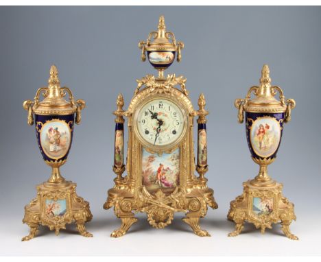 A French ormolu mantel clock garniture of ornate design having central figural design porcelain painted plaque with porcelain