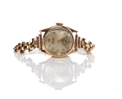 LADY'S TWENTIETH CENTURY EIGHTEEN CARAT GOLD HERODIA WRISTWATCHsigned manual wind movement, the silvered dial with applied Ar