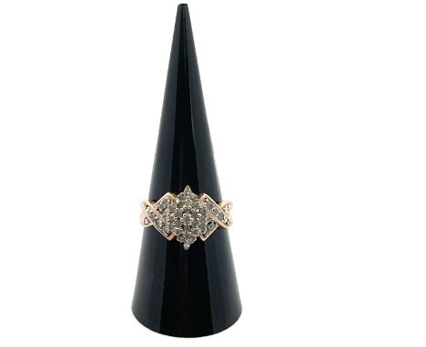 A 9ct gold and diamond cluster ring. Size P. London import hallmark, sponsor TGCC.