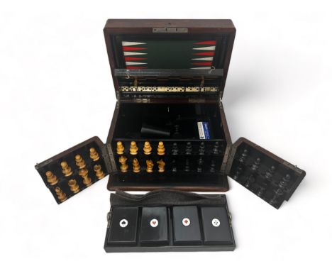 Impressive wooden games compendium having inlaid marquetry cards to top with internal chess board, chess pieces, dominoes, ca