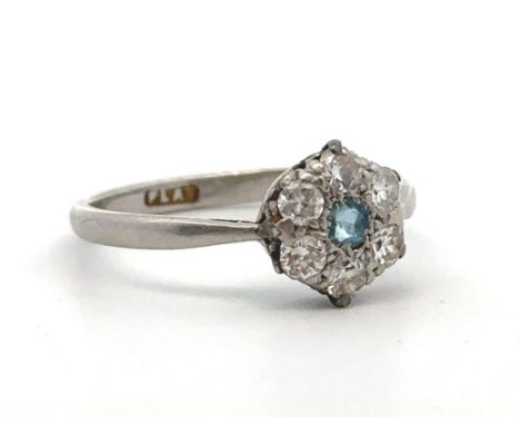 An aquamarine and diamond flower ring stamped PLAT. Size L. Estimated diamond weight 0.36ct. Weight 2.96g.