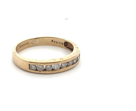 A 9ct gold and diamond ring, set with 8 round brilliant cut diamonds in a row. London import hallmarks,  Sponsor mark LBLd. S