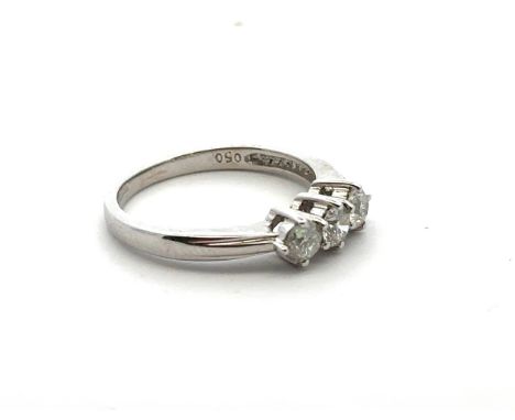 An 18ct gold three stone diamond ring, size L. Total diamond weight stamped on ring as 0.5ct. Sponsor RG. London hallmarks. W