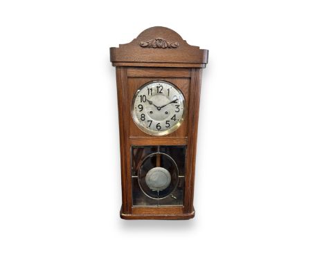 Junghans Hanging Wall Clock. With pendulum and key. Height 80cm x Width 32cm x Depth 18cm.&nbsp;BUYER TO COLLECT OR ARRANGE C