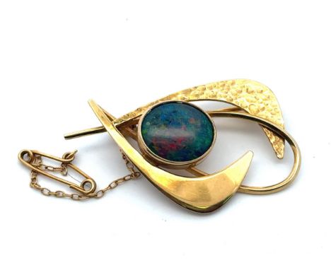 An imitation opal brooch, stamped 9ct. Length40mm, weight 6.13g. Please see the buyer's terms and conditions for purchasing d