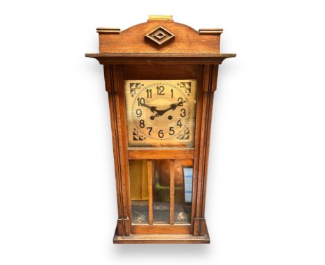 Two Vintage Wall Clocks. One cased wall clock, believed to be German, no visible makers marks, with key. One wall clock marke