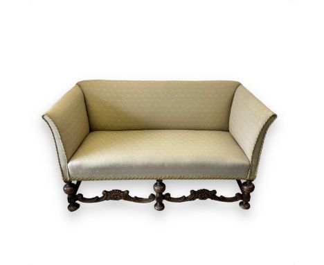 Danish 19th / 20th Century two seat sofa with carved oak frame, ornately carved to base, stood on five feet. Upholstered. Hei