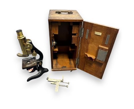 E. Leitz Wetzlar Microscope in fitted wooden case, model Number 103994 comes with a range of accessories. Wooden case has mak