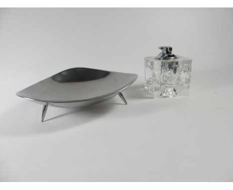 A BMI Keswick stainless steel dish of cushioned triangular form on three tapered feet, w. 19 cm, together with a clear glass 