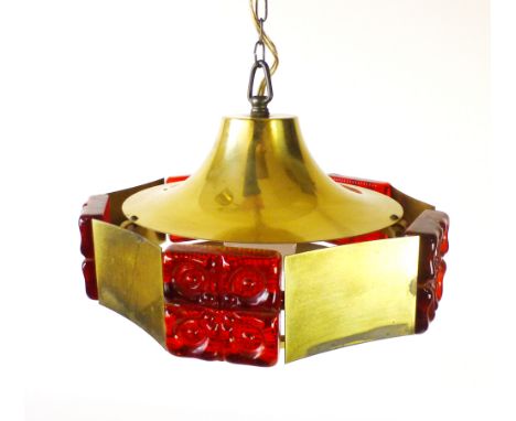 A 1970's brass coloured ceiling light with red moulded glass panels   CONDITION REPORT:  Working order unknown and not guaran