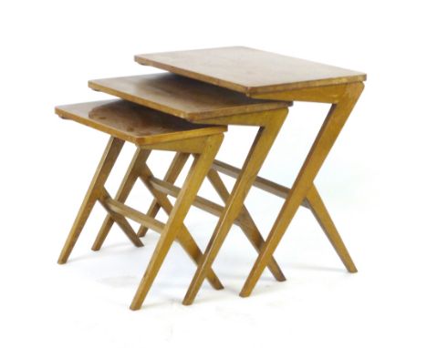 A nest of three 1950's Swedish walnut occasional tables on staggered legs by Bengt Ruda, max. w. 54 cm   CONDITION REPORT:  S