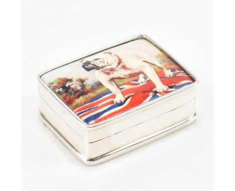 A Sterling silver pill box. The box of rectangular shape with enamel lidded panel, depicting an English bulldog stood atop a 