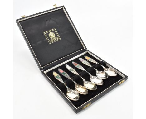 A set of six hallmarked silver and enamel teaspoons. The teaspoons made in 1976 to commemorate the "Year of the Rose", and th