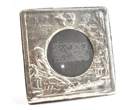 A hallmarked silver fronted easel back picture frame. The picture frame depicting scenes of a Japanese&nbsp;countryside. Circ