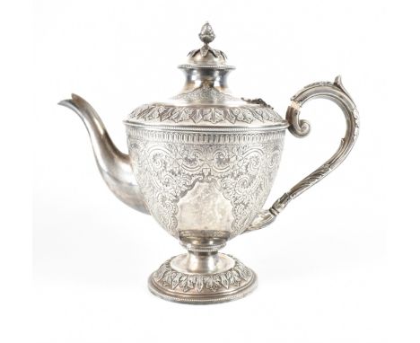 A hallmarked Victorian silver teapot. The teapot having extensive foliate decoration with acanthus decorated lid and pineappl