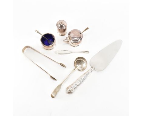 A hallmarked silver cruet set. The set comprising of a salt, mustard and pepper pots having blue glass liners. Pots hallmarke