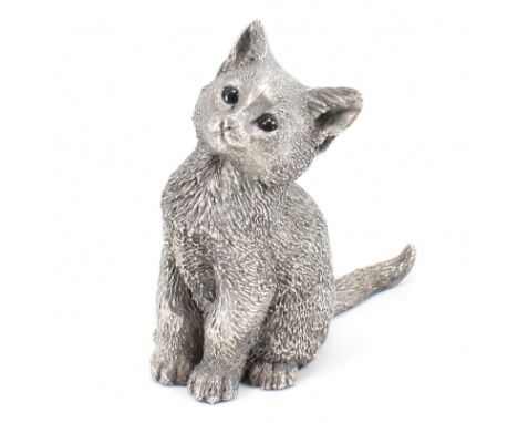 A hallmarked 925 silver country artists figure of a cat. The figure of a seated cat having enamel eyes. Hallmarked Birmingham