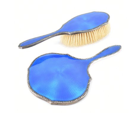 Two parts of an early 20th century hallmarked dressing table set. Lot to include a&nbsp;hand mirror and brush both with a mat
