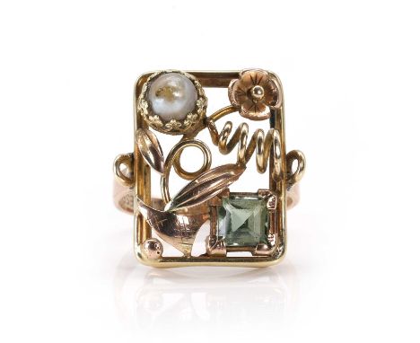 A Modernist plaque ring,  the open plaque of rectangular form with foliate and floral detail, bezel set with a split pearl, u