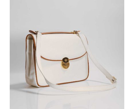A Gucci cream leather satchel bag, c.1985, with tan leather trim and top handle, detachable cream leather shoulder strap, gol