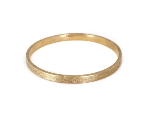 A 9ct gold bangle, a hollow rectangular bangle, with an engine turned pattern, 77mm internal diameter, Chester 1928, 10.95gCo